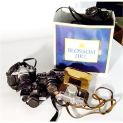 Four cased Pentax cameras with cased spare …