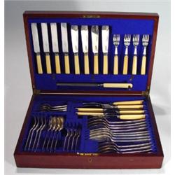 Mahogany cased four place canteen of silver…