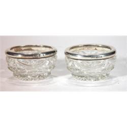 Pair of cut glass and silver rimmed salts, …