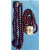 Image 1 : Red beaded bracelet on a gold coloured clas…