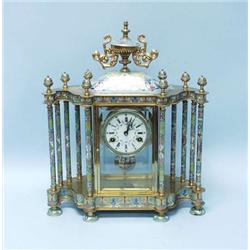 A cloisonne decorated mantel clock with a cir...