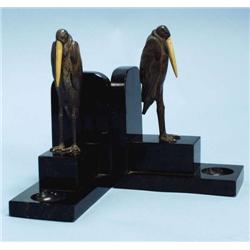 ART DECO - MANIN. A pair of silver patinated...