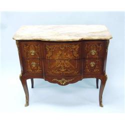 A Louis XV style petit commode. Fitted with t...