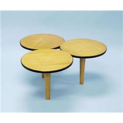 A 1950's fruitwood coffee table. The top is m...