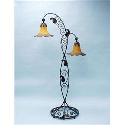 An unusual wrought iron and art glass floor l...