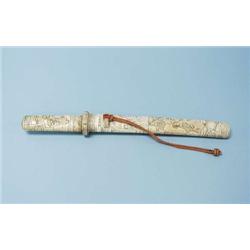 An antique Japanese ceremonial sword with ivo...