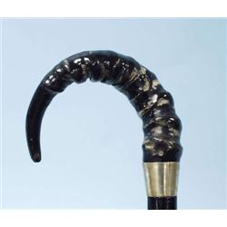 An English ebonized wood walking stick with c...