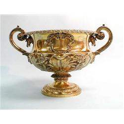 An important Georgian gilt silver urn with tw...