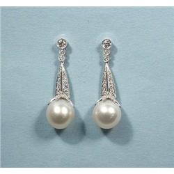 A pair of diamond set 18 kt. white gold earri...