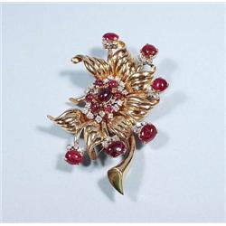 An 18 kt. gold, ruby and diamond retro brooch...