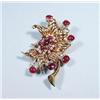 Image 1 : An 18 kt. gold, ruby and diamond retro brooch...
