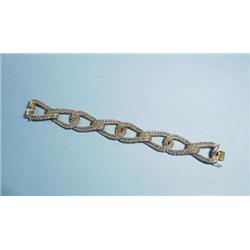 CARTIER - A 1950's 18 kt. two toned gold mesh...