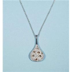 An 18 kt. white gold and diamond pendant and...