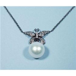 An 18 kt. gold and diamond butterfly pendant...