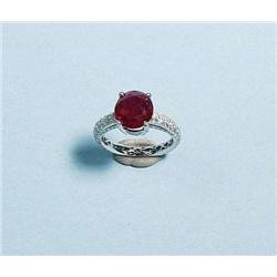 An 18 kt. white gold and ruby ring. The shank...