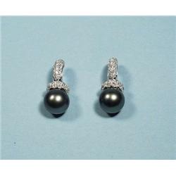 A pair of 18 kt. white gold and diamond earri...