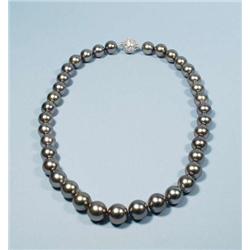 An important 11 - 13.5 mm. Tahitian black pea...