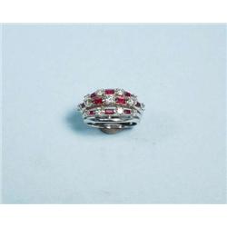 A platinum, ruby and diamond cluster ring. Th...
