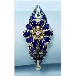 A 14 kt. yellow gold and diamond bangle brace...