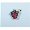 Image 1 : An 18 kt. yellow gold, ruby and diamond penda...