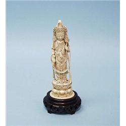 An antique Japanese ivory figure of a Buddha...