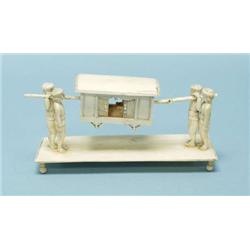 A finely carved antique miniature ivory group...