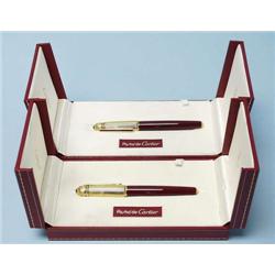 CARTIER, France - A complementary set of gold...