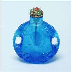 A Chinese blue glass snuff bottle with pierce...