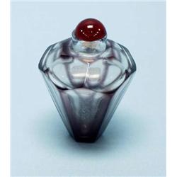 An unusual Chinese glass snuff bottle with he...