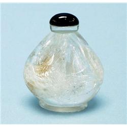 A Chinese rock crystal snuff bottle. With cab...
