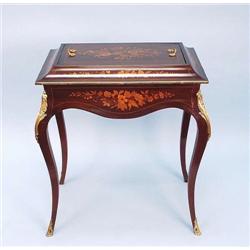 A good marquetry decorated mahagony covered j...