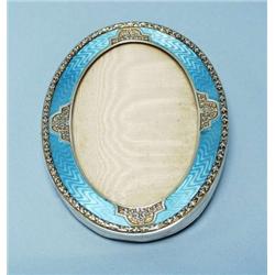 An unusual antique silver and enamel frame. O...