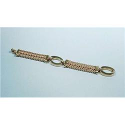 An 18 kt. yellow gold bracelet. Basket weave...