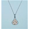 Image 1 : An 18 kt. white gold and diamond pendant and...