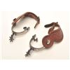 Image 1 : Pair of un-marked inlaid spurs with tooled  leather straps; nicely accomplished.      Est.:  $150-$3