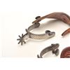 Image 3 : Pair of un-marked inlaid spurs with tooled  leather straps; nicely accomplished.      Est.:  $150-$3