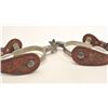 Image 5 : Pair of steel silver spurs with tooled  leather straps; consignor indicates Crescent  City Prison or