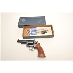 Smith & Wesson Model 19-3 DA revolver, .357  Magnum caliber, 4” barrel, blued finish,  checkered woo