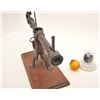 Image 5 : Antique iron glass target ball thrower on  wood display base with two glass target  balls, one marke