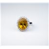 Image 1 : Incredible ‘Princess Diana’ style ring set  with a large oval Yellow Sapphire weighing  12.20 carats