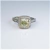 Exceptional ladies ring featuring a center  2.02 carat Fancy Yellow diamond of VS clarity  and surro