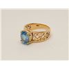 Image 2 : One Swiss blue oval topaz weighing approx 6ct  set in an ornate filigree 14k yellow gold  mounting. 