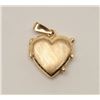Image 1 : One 14k heart shaped locket weighing 5.73  gms. Est. $300-$600.