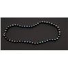 Image 1 : One strand of fine black pearls, 9.5mm in  diameter and 20 inches long. Est. $300-$600.