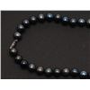 Image 2 : One strand of fine black pearls, 9.5mm in  diameter and 20 inches long. Est. $300-$600.
