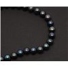 Image 3 : One strand of fine black pearls, 9.5mm in  diameter and 20 inches long. Est. $300-$600.