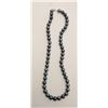 Image 4 : One strand of fine black pearls, 9.5mm in  diameter and 20 inches long. Est. $300-$600.