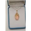 Image 3 : One salmon corral set in an ornate pendant  made in 14k yellow gold. Est. $200-$400.