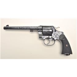 Colt New Service DA revolver, engraved  (non-factory), .44-40 caliber, 7.5” barrel,  re-blued finish