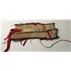 Image 1 : Pipe bone breast plate with brass beads,  rawhide fringe and fur trim; approximately  24” x  10” wid